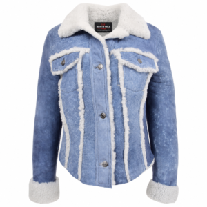 Women's radiant blue real sheepskin trucker jacket featuring plush white shearling collar, white fleece trim detailing along the seams and chest flap pockets, and button-down closure.