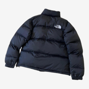 Back view of The North Face Men’s 1996 Retro Nuptse navy puffer jacket with quilted insulation, stand collar, elasticated cuffs and embroidered shoulder logo.
