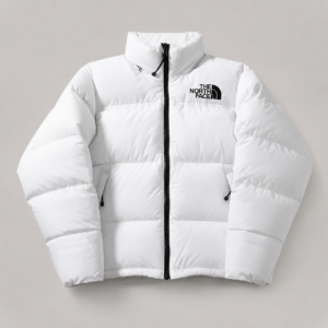 The North Face Men’s 1996 Retro Nuptse white puffer jacket with a high collar, black full-zip closure, quilted insulation, side pockets and black chest logo.